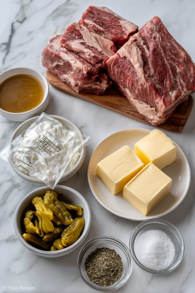 Five ingredients for mississippi pot roast displayed on white marble in kitchen light