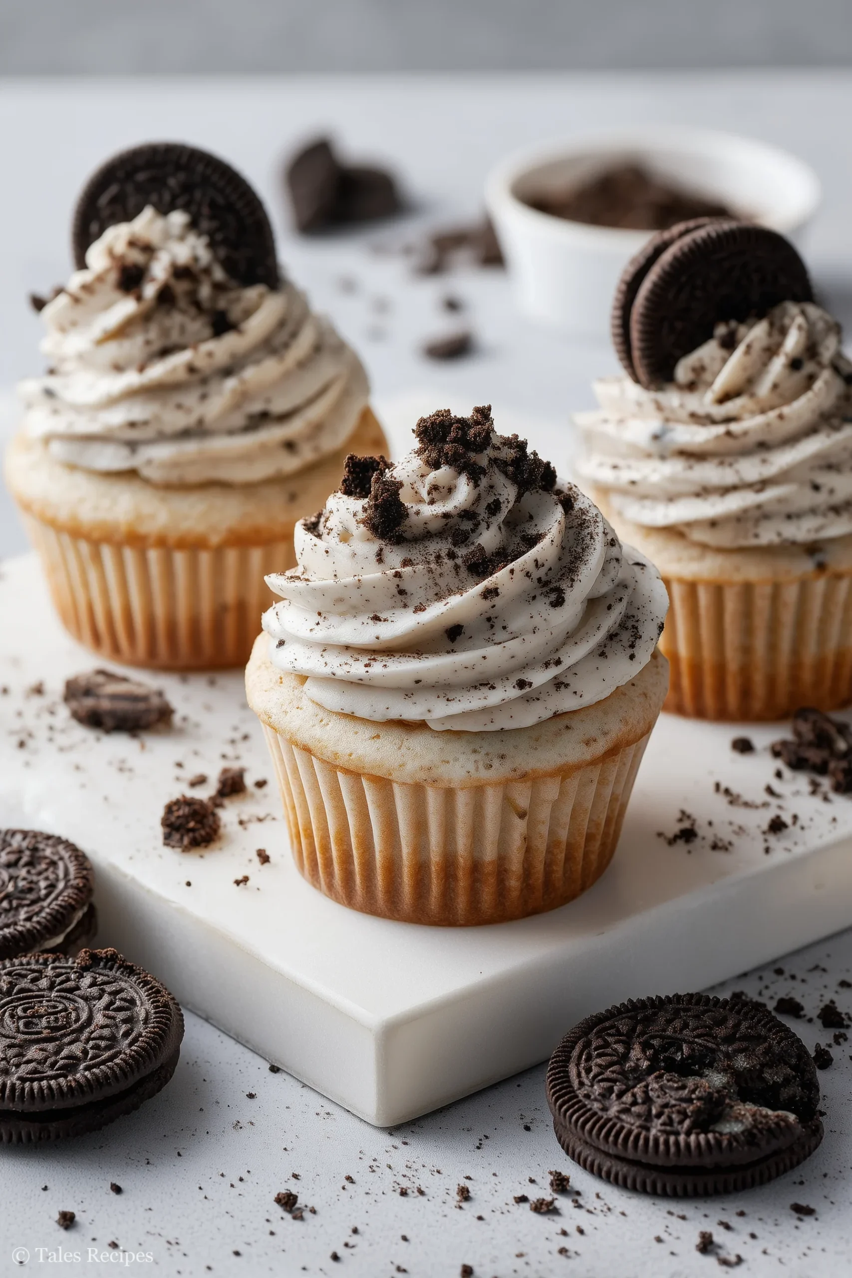 Bakery Oreo cupcakes with cookies-and-cream frosting on white marble countertop